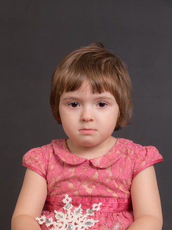 portrait of a little sad girl close upの写真素材