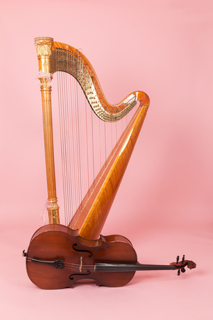 harp and cello on a pink backgroundの写真素材