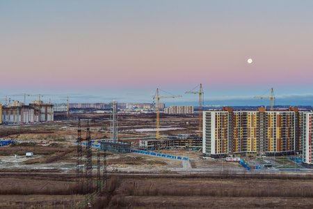 cold sunrise over the city and the construction siteのeditorial素材