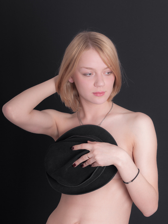 portrait of a naked girl with a hatの写真素材