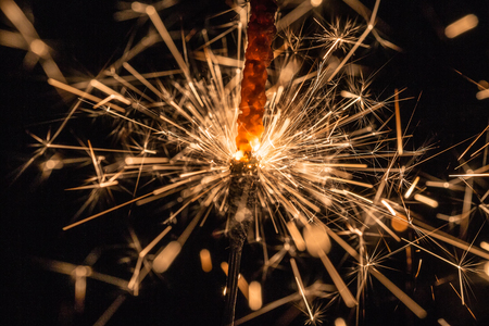 abstract sparks close up on a black backgroundの写真素材