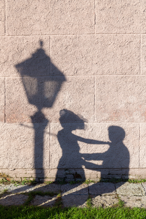 shadow of a couple in love on the wallの写真素材