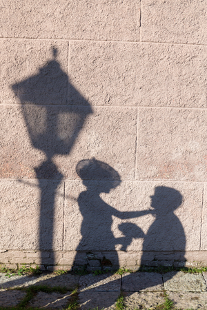 shadow of a couple in love on the wallの写真素材