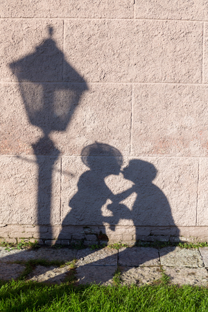 shadow of a couple in love on the wallの写真素材