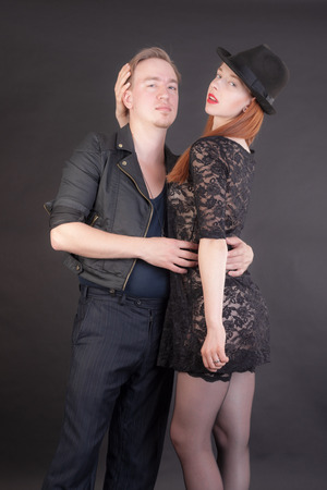 studio portrait of a romantic couple on a black backgroundの写真素材