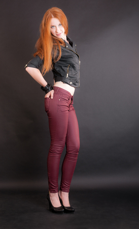 portrait of a slim girl in a black jacketの写真素材