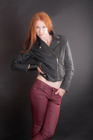 portrait of a slim girl in a black jacketの写真素材