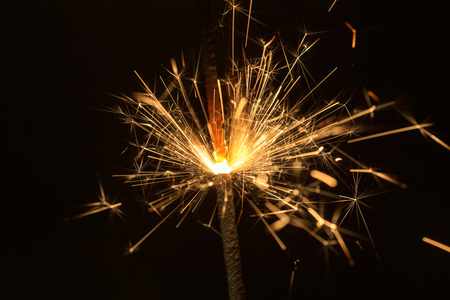 pyrotechnics sparks on black background close up