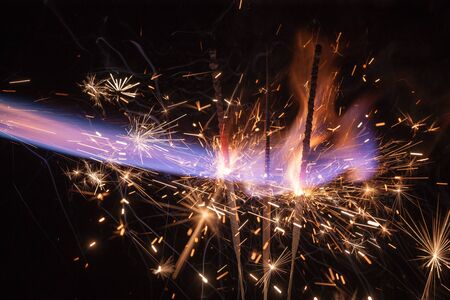abstract fireworks lights on black background closeupの写真素材