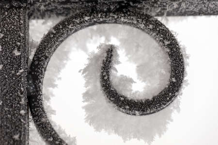 frost on a fragment of a metal fence closeupの写真素材