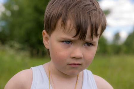 portrait of a boy with eyes of different colors