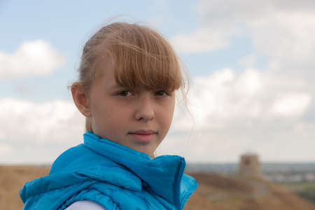 portrait of a girl against the sky