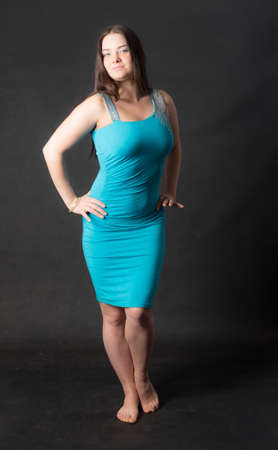 studio portrait of a girl in an azure dressの写真素材