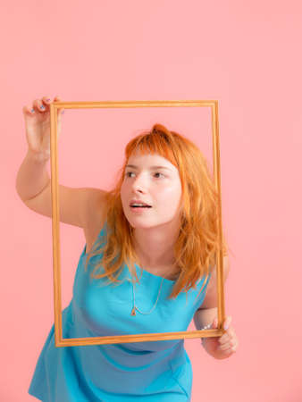 studio portrait of a girl in a frameの写真素材