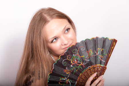 portrait of a sensual girl with a fanの写真素材