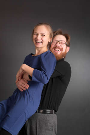 studio portrait of couple on black background