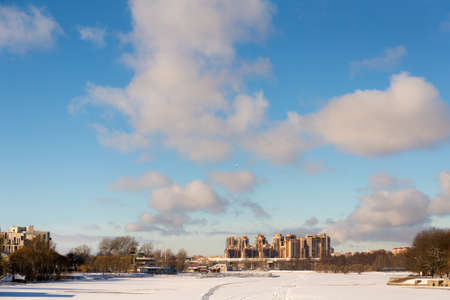 landscape with frozen river in city winter parkの写真素材