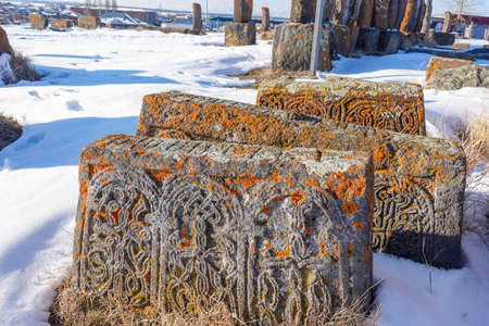 An ancient Armenian tombstone with carvings on it, Noratus Cemetery - Armeniaの写真素材
