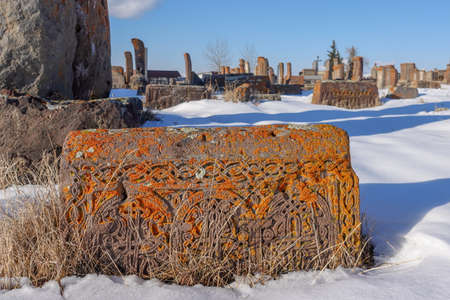 An ancient Armenian tombstone with carvings on it, Noratus Cemetery - Armeniaの写真素材