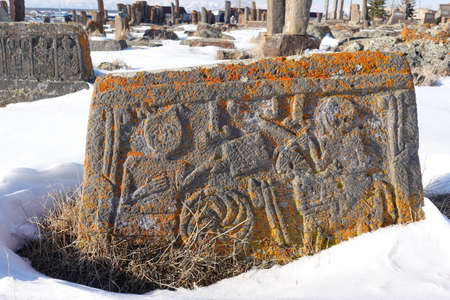 An ancient Armenian tombstone with carvings on it, Noratus Cemetery - Armeniaの写真素材