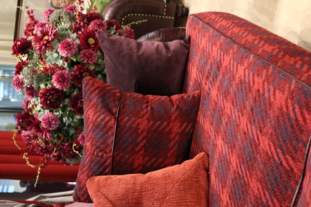 sofa with pillows in the same color scheme in the interiorの写真素材