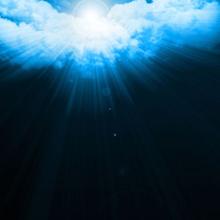 Sunrays through clouds with room for copy
