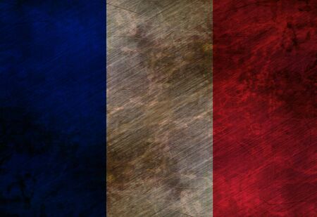 worn french flag waving in the windの写真素材