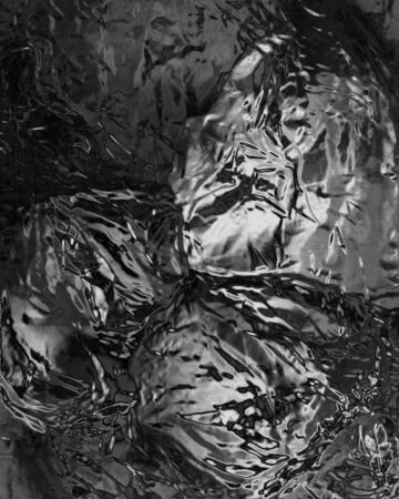 wrinkled silver foil with some smooth lines in itの写真素材