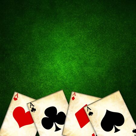 old playing cards on a green background