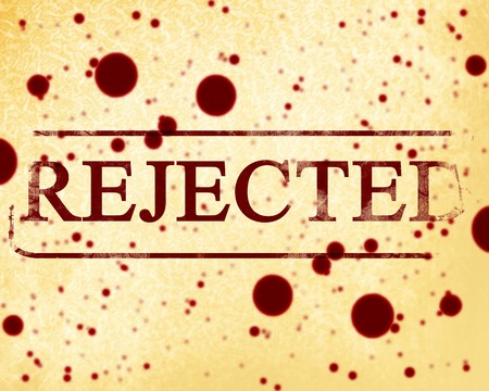 old rejected stamp on a paper backgroundの写真素材