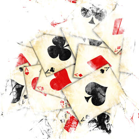 old playing cards on a white backgroundの写真素材