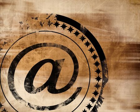 email symbol on an old paper textureの写真素材