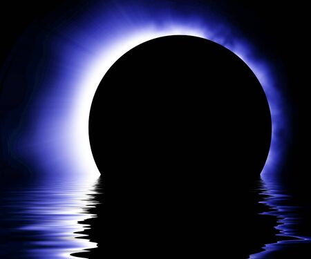 Glowing blue eclipse on a dark backgroundの写真素材