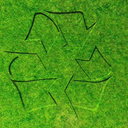 grass texture with the recycle sign in itの写真素材