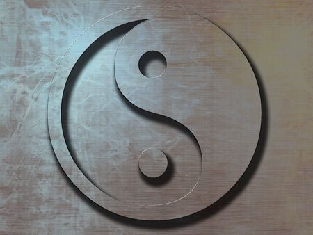 yin yang sign on a metal plate backgroundの写真素材