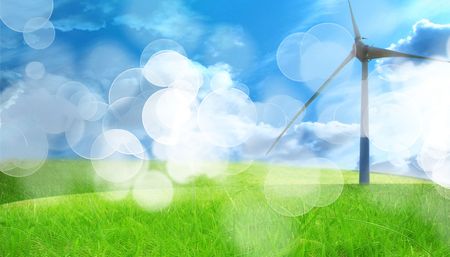 wind turbine in a field with a blue sky above