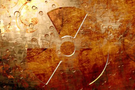 Grunge metal plate with a nuclear sign on itの写真素材
