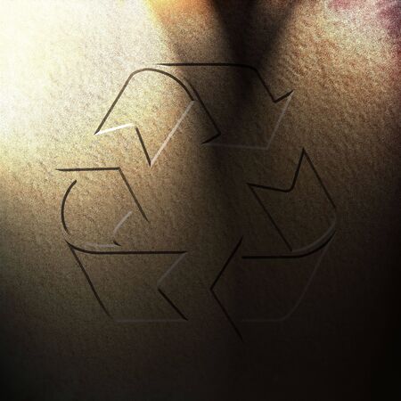 wet sand with the recycle symbol in itの写真素材