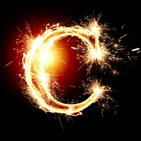 sparkling font: letter C on a dark backgroundの写真素材