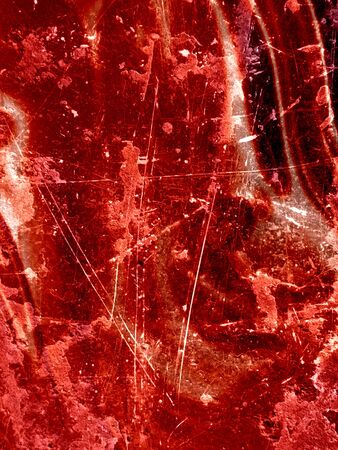 grunge red background with some damage on itの写真素材