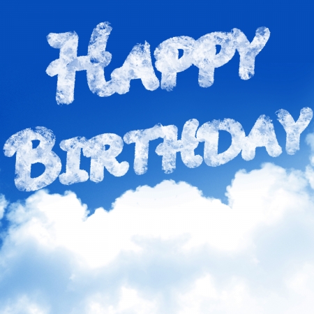 clouds in a blue sky with the words 'happy birthday'の写真素材