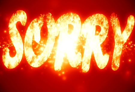 sorry written on a glowing red backgroundの写真素材