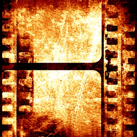 grunge brown filmstrip with some spots and stains on itの写真素材