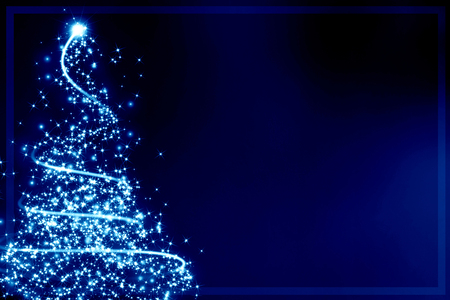 xmas greeting card with a christmas tree and some sparklesの写真素材