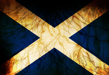 Scottish flag waving in the wind with some spots and stainsの写真素材