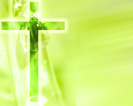 glowing christian cross on a green nature backgroundの写真素材