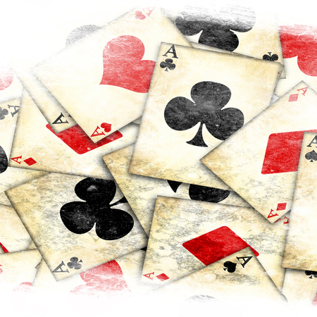 grunge playing card on a soft brown backgroundの写真素材