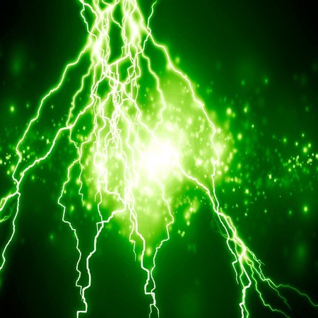 bright electrical spark on a dark green backgroundの写真素材