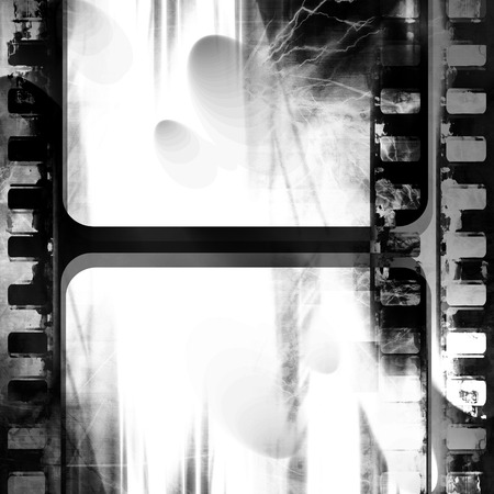 old black and white negative film strip with some spots and stains on itの写真素材