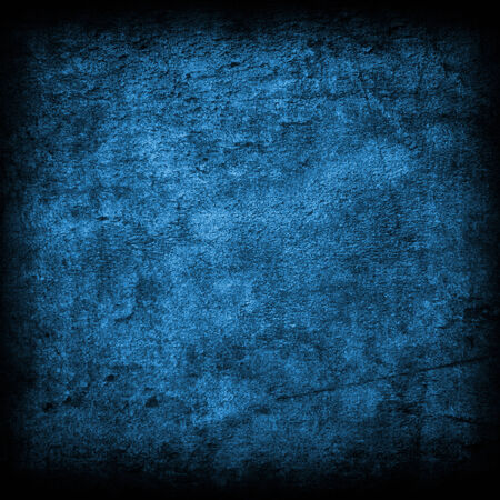 grunge blue background with some spots and stains on itの写真素材